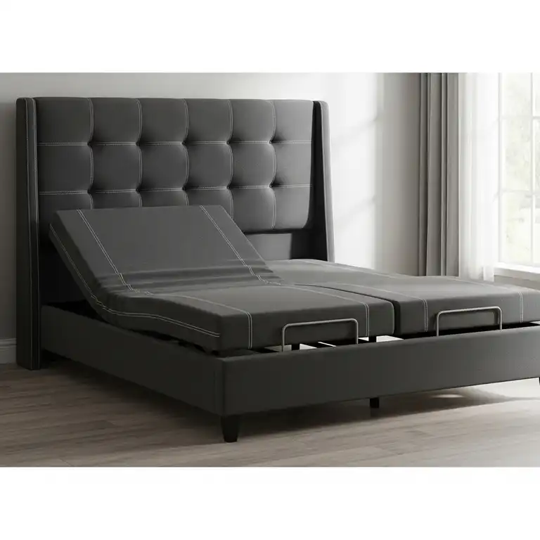 A modern king bed frame for adjustable base with headboard and dark gray upholstery.